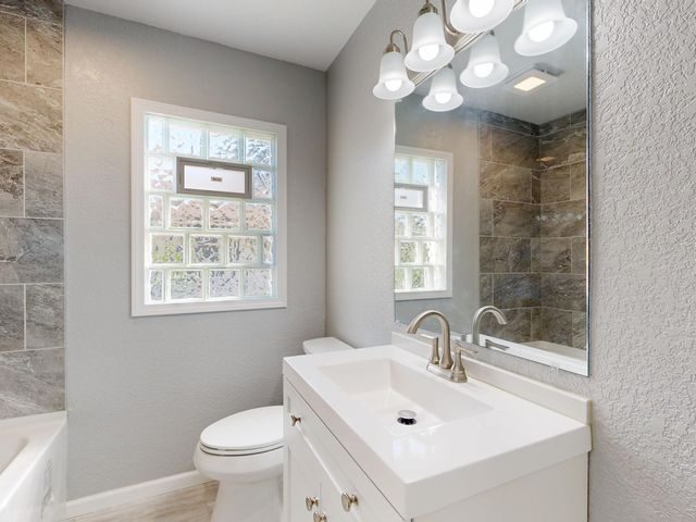 Custom shower remodel with glass enclosure and tiled walls
